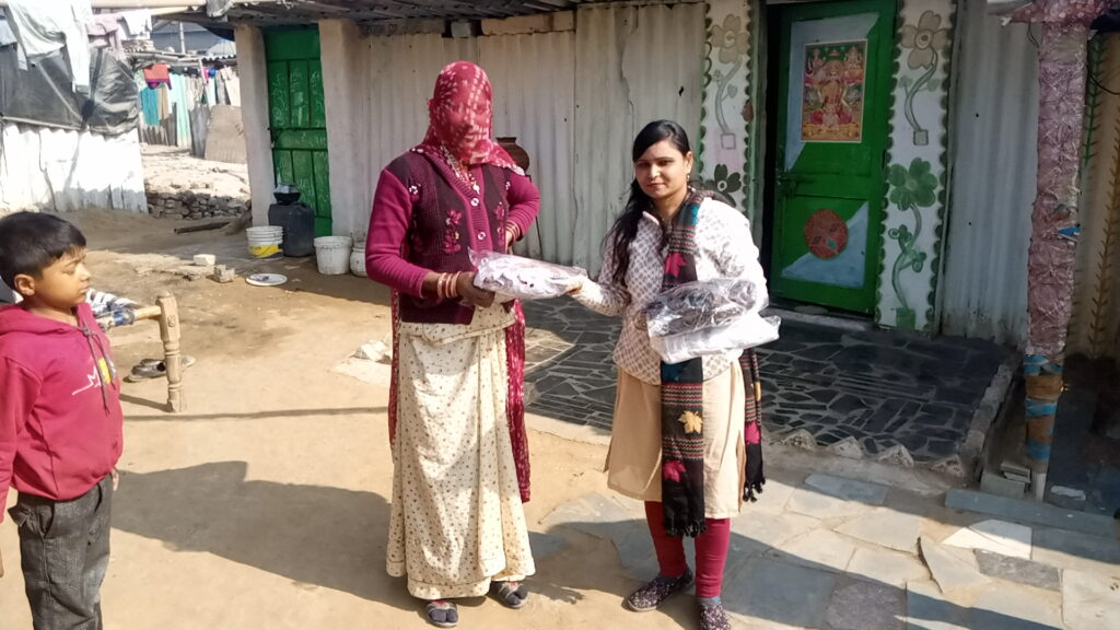 Volunteers distributing clothes to poor peoples during charity event