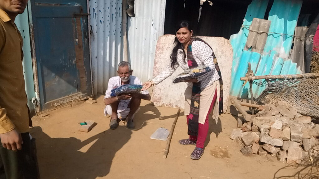 Volunteers distributing clothes to poor peoples during charity event